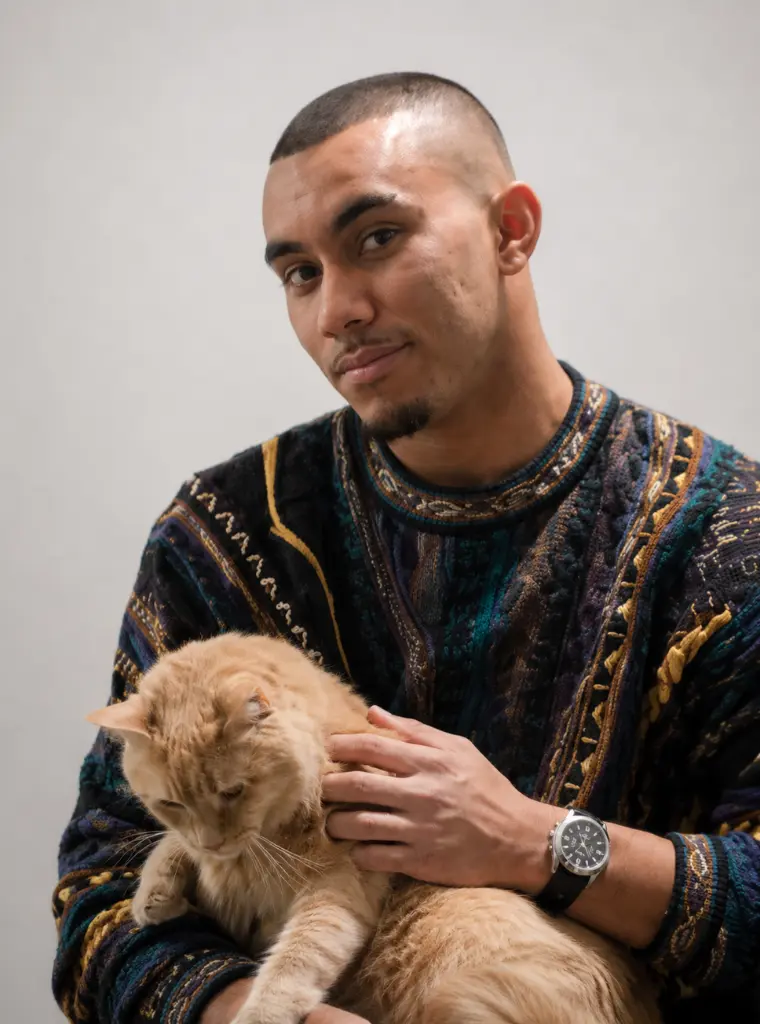 Nathan Officer holding a ginger cat